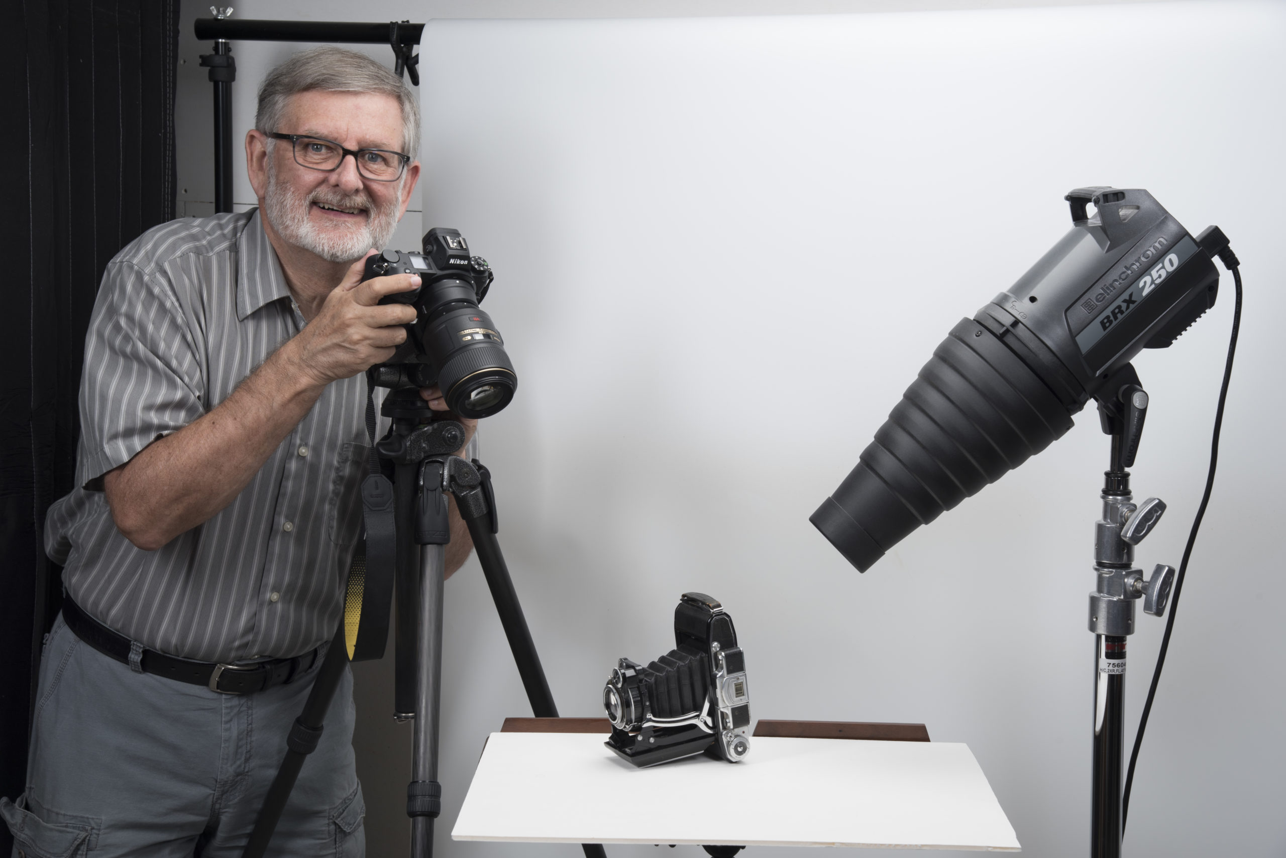 John Pattenden photographing an old camera in his studio